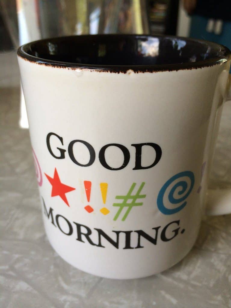 coffee mug with curse words (implied)