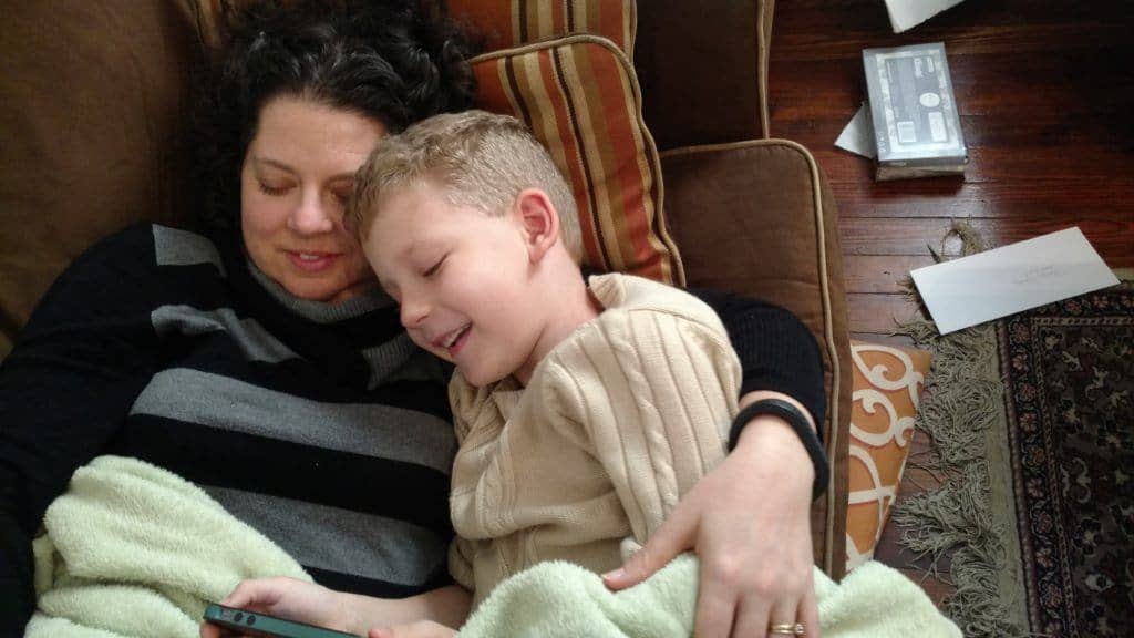 My stay-at-home-mom wife snuggling with our son.