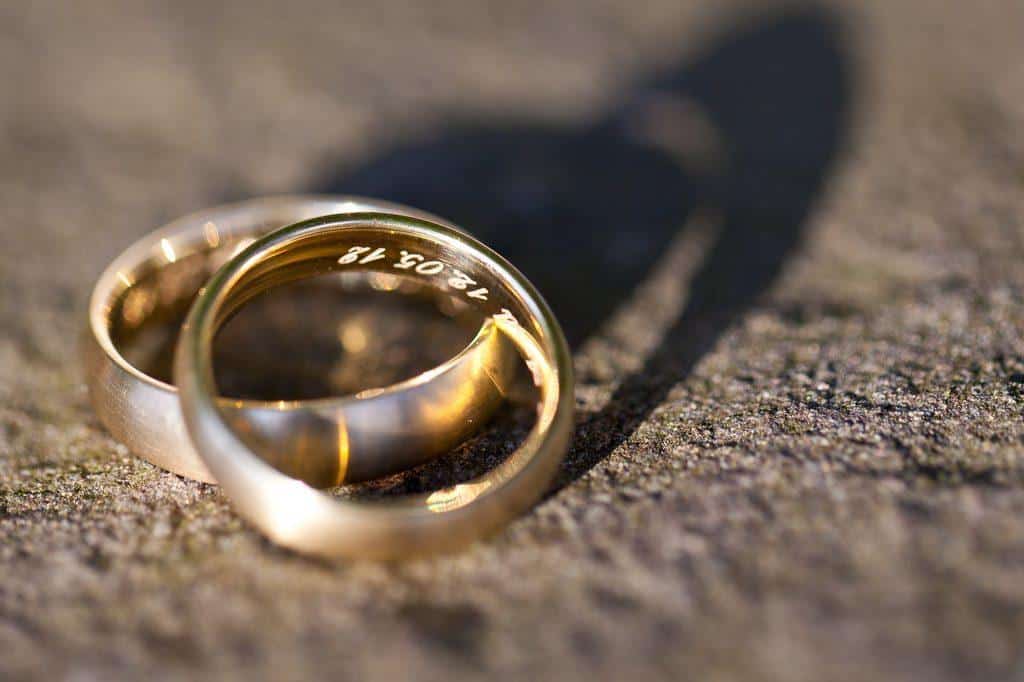weddings rings in sand
