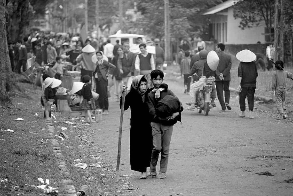 woman and boy walk together